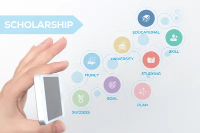 tangan memegang gadget yang mengeluarkan berbagai ikon scholarship